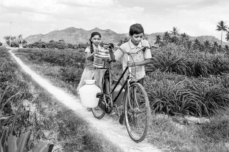 Children and Water - Siblings fetching sweet and safe water back home from a distant irrigation tubewell in Kolar district, Karnataka